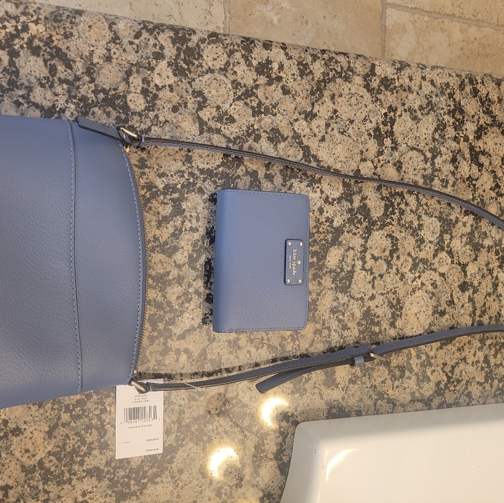 Kate spade crossbody purse and matching bifold wallet blue in color